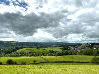 Landscape view from, Carr Lane, with fields, houses, and meadows, on a cloudy day in, East Morton, Keighley, UK