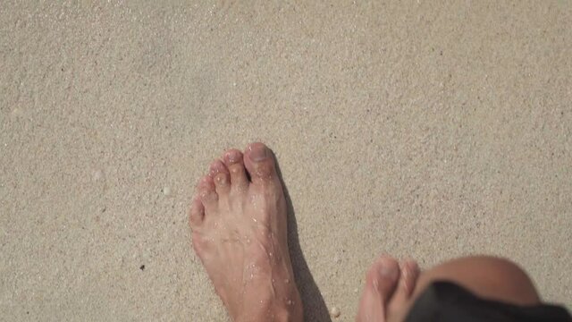 feet on the sea sand