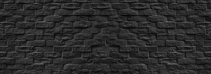 Surface of Vintage black brick wall background.