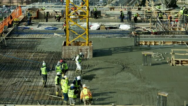 Timelapse video of Pouring concrete floors of highrise Construction. 