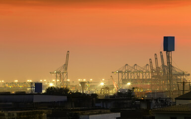 Cargo port at twilight sky.