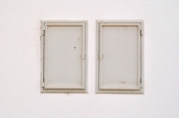 Close Up of Wall with Doors for Access to Service Meters 