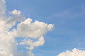 Naklejka na ściany i meble Blue sky with white clouds in the daytime background.