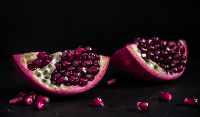 Fresh Pomegranate in black texture background
