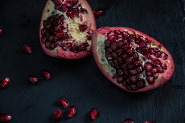 Fresh Pomegranate in black texture background