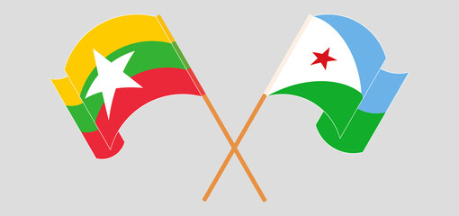 Crossed and waving flags of Myanmar and Djibouti