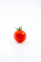 lonely cherry tomato on white background