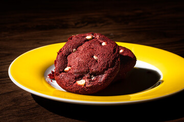 Red Velvet cookie with white chocolate on the dark wooden table
