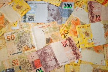 Brazilian money bill.  Two hundred bill, ten, twenty, and fifty real bill. Top view