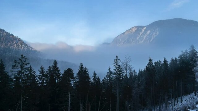 Hyperlapse of Winter Sunset at a foggy Lake Spitzingsee