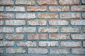 Brick wall with muted colors for background, wallpaper, or screen saver.