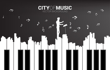 Vector silhouette of conductor with piano key shaped the the big city outline silhouette. Background concept for classic song event and music festival