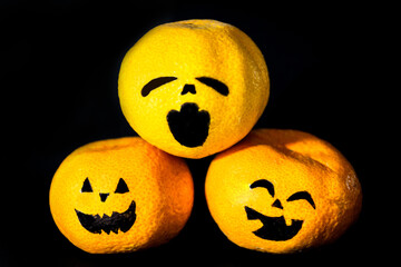 Halloween time with creative oranges instead of pumpkins. Halloween time for celebration. Halloween ritual Trick or Treat.