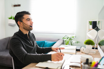 Side view of a young man working as an interpreter