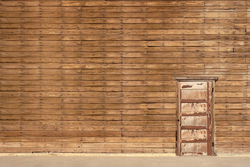 Old wooden building exterior wall with a door