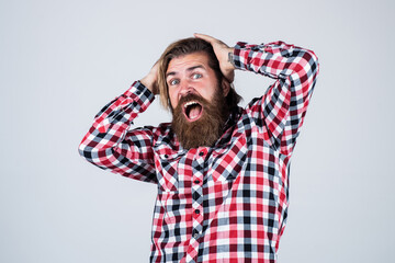 scared handsome bearded guy with unshaven face and stylish hairdo wear casual clothes, stress