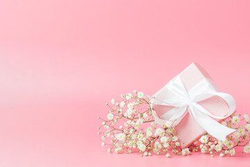 Gift box on pink background. There is room for text.