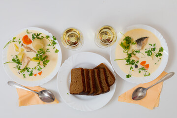 Salmon fish soup. Culinary background with selective focus