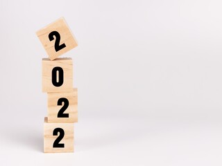 Text 2022 on wooden cubes isolated on white background.Business concept.