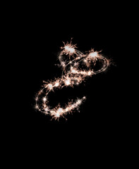 the letter e made from sparks of Bengal lights isolated on a black background.