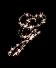 the letter g made from sparks of Bengal lights isolated on a black background.