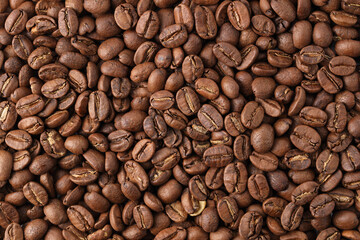 Freshly roasted coffee beans background top view using for your advertising