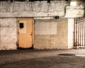 Interior of industrial grungy garage with gates.