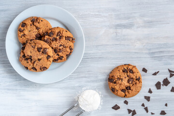 Organic fresh bake homemade food snack tasty sweet dessert piece of salted cookie chocolate chip flour egg closeup on dark wooden table for holiday new year Christmas gift decorate with sugar sparkle