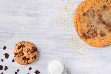 Organic fresh bake homemade food snack tasty sweet dessert piece of salted cookie chocolate chip flour egg closeup on dark wooden table for holiday new year Christmas gift decorate with sugar sparkle