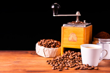 Fresh cafe for morning breakfast refresh caffeine white cup roasted organic coffee bean farm in vintage wood grinder classic metal coffee pot for black espresso and cream milk cappuccino latte