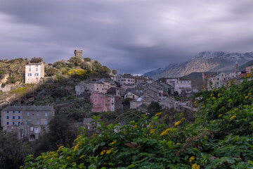 Fototapeta premium The small village of Nonza in winter, on a cloudy day. Corsica