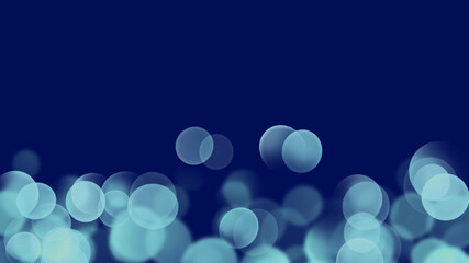 水色の玉ぼけと抽象的な暗い青色の背景イメージ