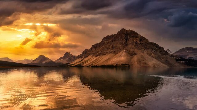 Cinemagraph Continuous Loop Animation. Beautiful Canadian Nature landscape view of Bow Lake in Banff National Park, Alberta, Canada. Dramatic Colorful Stormy Sky. Scenic Background