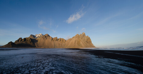 Jagged Vestrahorn Mountain in Iceland during winter with clear sky.