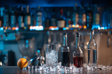 set of ingredient for negroni cocktail with ice, orange, rum, vodka and liquor