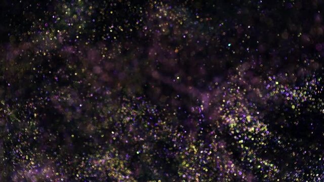 Decoration bokeh lights background video. Abstract blurred backdrop with circles in motion. Footage with liquid twinkling particles. Colored and bright fluent animation with blur effect