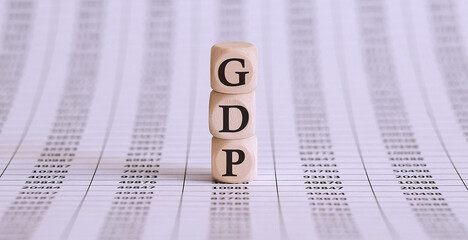 GDP word on wood blocks concept on the chart papers
