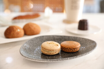 brown macaron dessert in coffee shop background