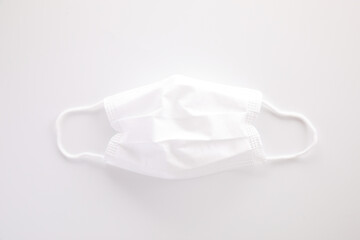 Used white mask isolated in white background