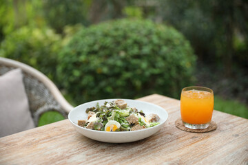 caesar salad appetizer on wooden background