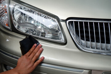 Hands of people polishing cars