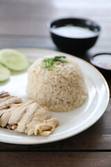Thai food gourmet steamed chicken with rice khao mun kai in wood background