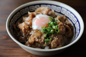 pork rice bowl with egg on wood backround japanese local food butadon