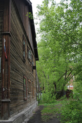 wall facade of the old wooden house in the garden