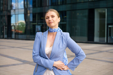 Portrait of a beautiful business woman on the background of an office building