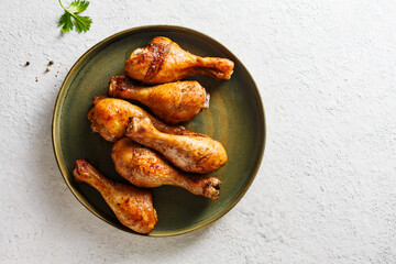 Baked chicken legs with spices. Top view.