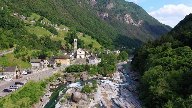 Aerial footage of the famous Lavertezzo village with its stone bridge in the Verzasca valley in Canton Ticino in Switzerland