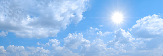 Beautiful blue sky with white clouds and sun