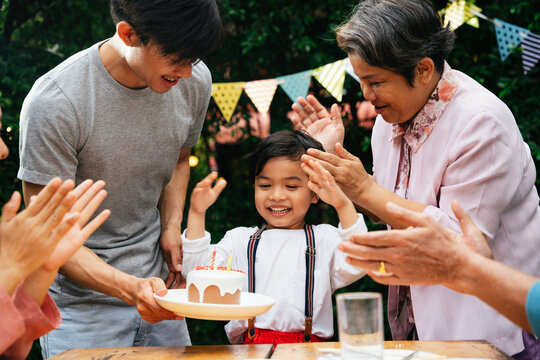 Portrait asian family in birthday party.