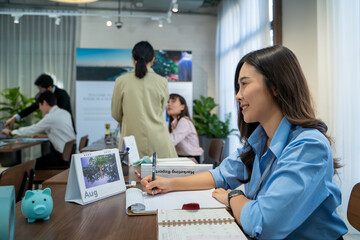 Happy smiling Asian business woman working at office.